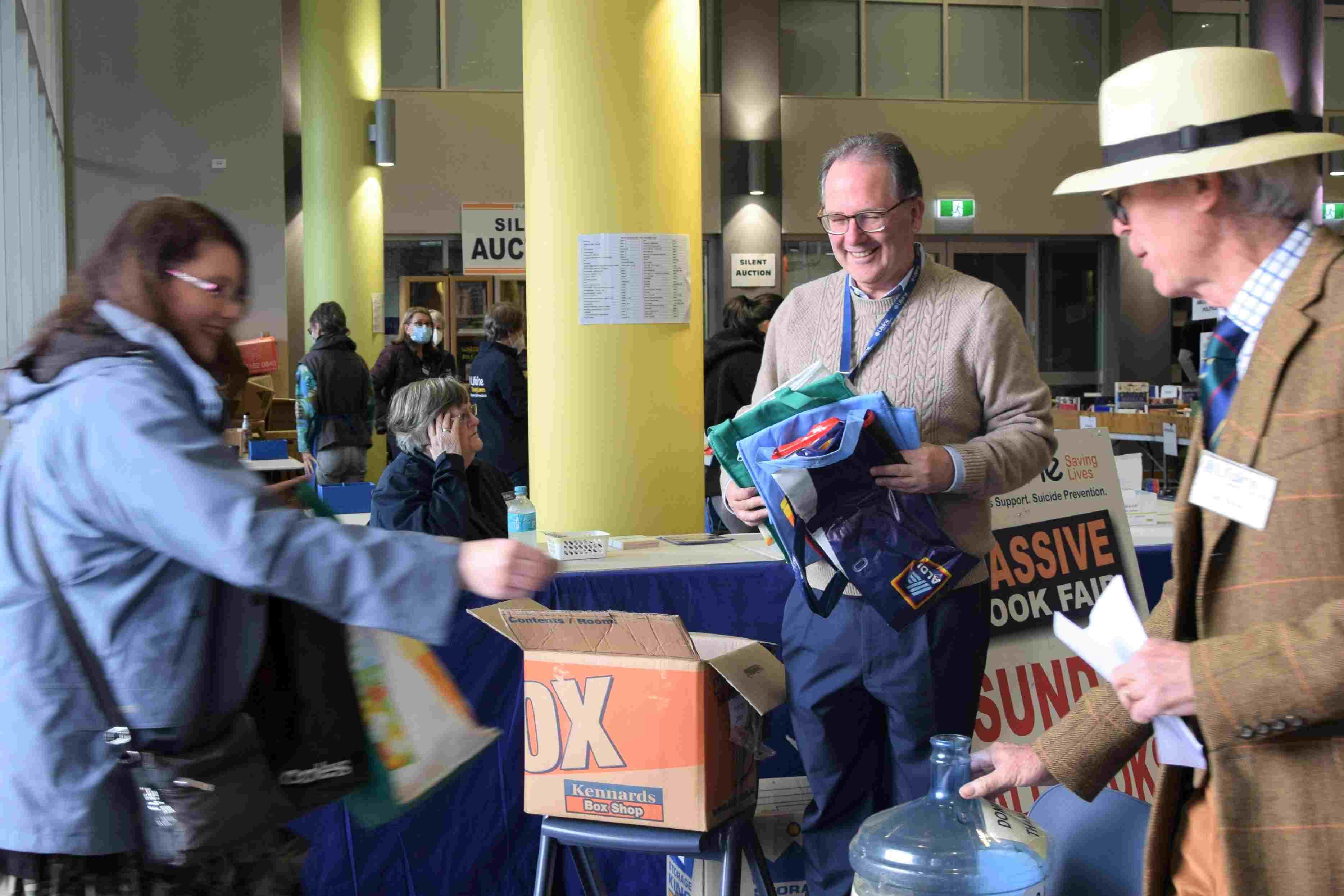 People donating to Lifeline book fair