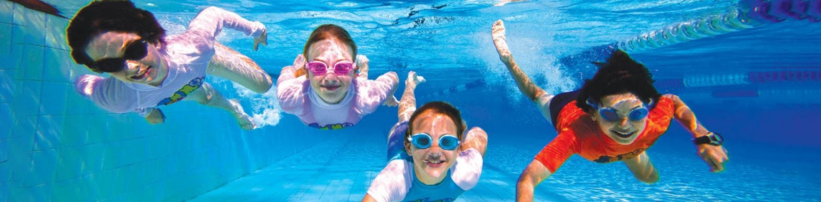 Kids swimming in a pool 
