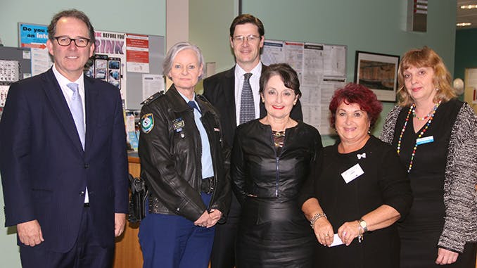Alister posing with NSW Government MPs and NSW Police 