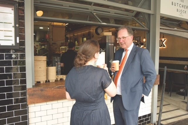 Alister Henskens SC MP drinking coffee with constituent in Wahroonga Village