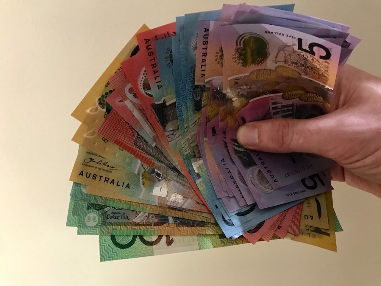 Hand holding Australian money