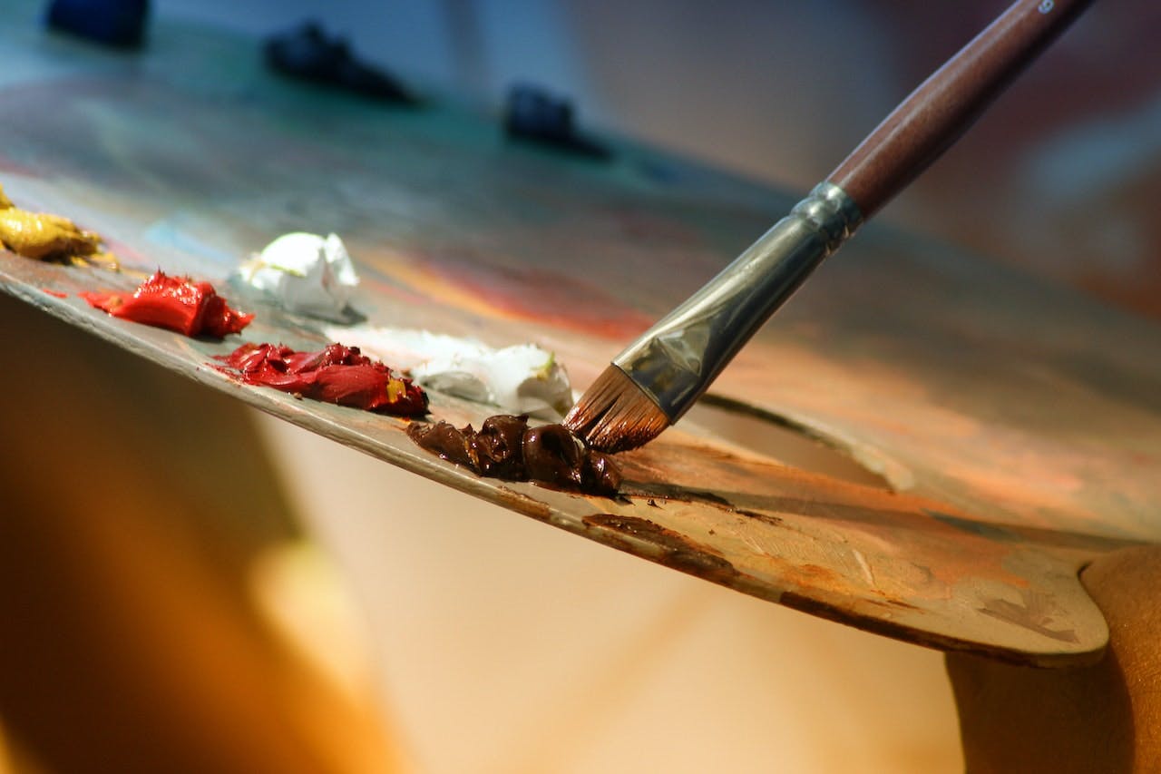 Palette of paint and paintbrush