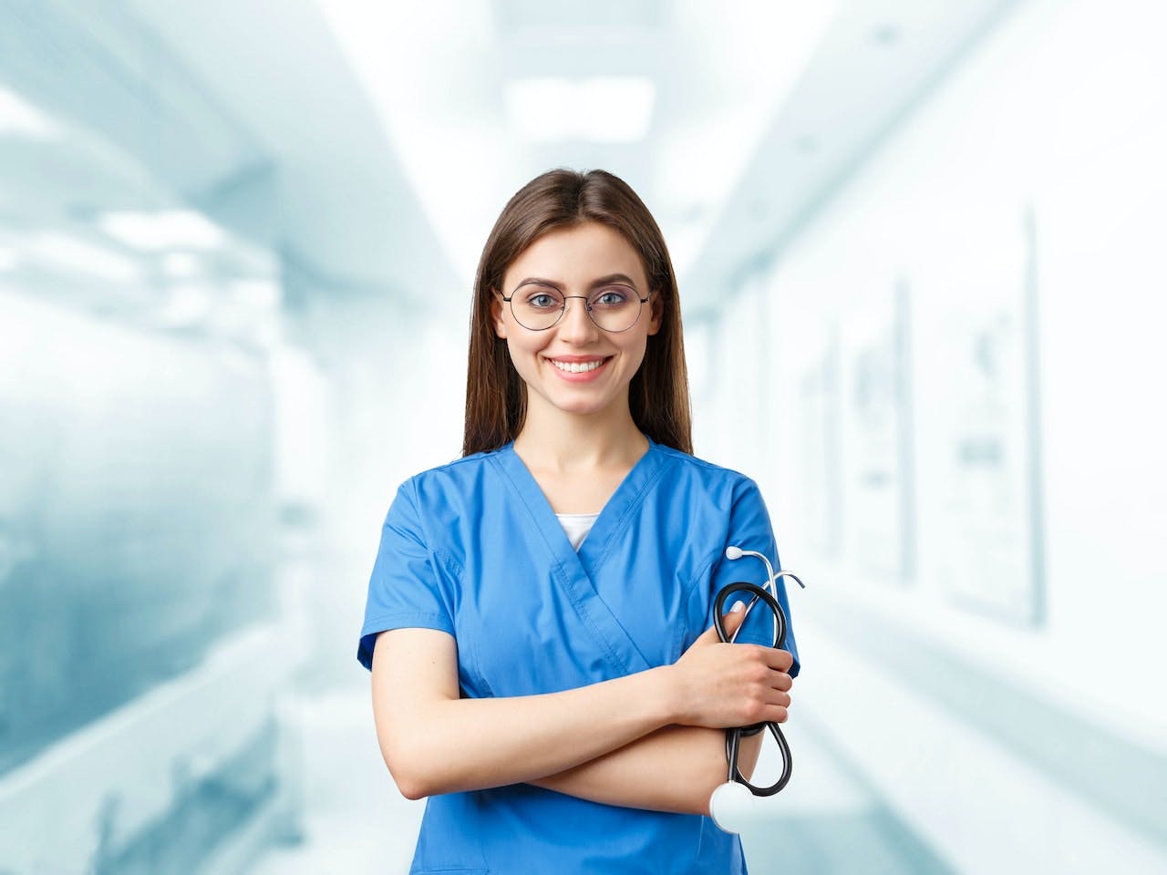 Female junior doctor holding stethoscope